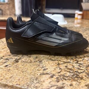 adidas Kids Black Soccer Cleats with Gold Accents